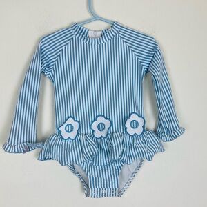 Classic Whimsy long sleeve blue and white seersucker swimsuit w/ daisy appliqué